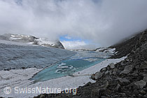 Photo: Wolkenstimmung über Gletschersee